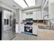 Bright kitchen featuring stainless steel appliances and ample counter space for cooking and dining at 7507 Duo Lakes Dr, Orlando, FL 32810