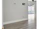 Neutral wall colors complement the flooring and trim; sliding glass door offers a view outdoors at 7507 Duo Lakes Dr, Orlando, FL 32810