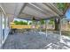 Backyard patio with pavers, featuring a ceiling fan, outdoor lighting, and space for seating at 7507 Duo Lakes Dr, Orlando, FL 32810