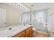 Bathroom with double vanity, modern shower curtain, and tiled floors at 802 Pickfair Ter, Lake Mary, FL 32746