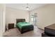Bright bedroom with ceiling fan and sliding doors leading to the patio at 802 Pickfair Ter, Lake Mary, FL 32746