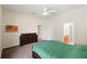 Bright carpeted bedroom features ceiling fan and an ensuite bathroom at 802 Pickfair Ter, Lake Mary, FL 32746