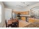 Bright eat-in kitchen features stainless steel appliances, granite counters, tile floor, and wood cabinets at 802 Pickfair Ter, Lake Mary, FL 32746