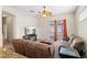 Bright living room features fan, fireplace and sliding glass doors with access to the patio at 802 Pickfair Ter, Lake Mary, FL 32746