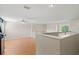 Open concept loft area featuring hardwood floors, natural light, and a ceiling fan at 802 Pickfair Ter, Lake Mary, FL 32746