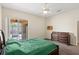 Bright main bedroom features ceiling fan and sliding glass doors with access to the patio at 802 Pickfair Ter, Lake Mary, FL 32746