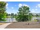 Community playground featuring swings and a scenic lake view, perfect for outdoor Gathering activities at 802 Pickfair Ter, Lake Mary, FL 32746