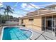 Backyard screened in pool is surrounded by lush landscaping for privacy at 802 Pickfair Ter, Lake Mary, FL 32746