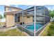 Backyard is screened in around the pool with view of the yard at 802 Pickfair Ter, Lake Mary, FL 32746