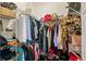 Walk-in closet featuring metal shelving, filled with an array of clothing, shoes, and accessories at 802 Pickfair Ter, Lake Mary, FL 32746