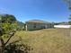 The house has a spacious backyard at 8398 Split Creek Cir, Lakeland, FL 33809