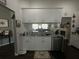 Kitchen featuring white cabinetry, granite countertops, stainless steel appliances, and neutral paint at 8398 Split Creek Cir, Lakeland, FL 33809