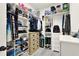 Spacious walk-in closet with custom shelving and drawers for optimal organization and storage at 8448 Greenbank Blvd, Windermere, FL 34786
