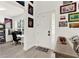 Inviting entryway featuring decorative artwork and a glimpse into the adjacent home office at 8448 Greenbank Blvd, Windermere, FL 34786