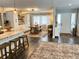 Bright dining area with open concept includes an island, stools, and a large dining table at 8484 Sandberry Blvd, Orlando, FL 32819