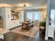 Open dining room features a large wooden table, bench seating, and built-in storage at 8484 Sandberry Blvd, Orlando, FL 32819