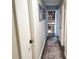 Hallway view leading to a bright room with built in bookcase at 8484 Sandberry Blvd, Orlando, FL 32819