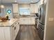 Spacious, updated kitchen with stainless steel appliances and white cabinets at 8484 Sandberry Blvd, Orlando, FL 32819