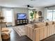 Inviting living room boasts neutral tones, comfortable seating, and a ceiling fan at 8484 Sandberry Blvd, Orlando, FL 32819