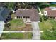 Aerial view of the home, showcasing its well-manicured lawn and prime location at 8830 Ladrido Ln, Orlando, FL 32836