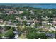 Aerial view of the residential community and lush greenery of the home's surroundings at 8830 Ladrido Ln, Orlando, FL 32836