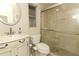 Well-lit bathroom features a glass-enclosed shower and stylish vanity at 8830 Ladrido Ln, Orlando, FL 32836