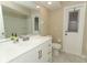Bright bathroom with a white vanity and walk-out door at 8830 Ladrido Ln, Orlando, FL 32836