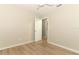 Bright bedroom with wood floors and neutral walls at 8830 Ladrido Ln, Orlando, FL 32836