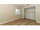 This bedroom features wood floors and a spacious closet at 8830 Ladrido Ln, Orlando, FL 32836
