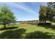 Scenic view of a wooden fishing pier extending into the lake with lush green surroundings at 8830 Ladrido Ln, Orlando, FL 32836