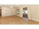 Bright living area with wood-look floors leading to a screened-in patio with ample natural light at 8830 Ladrido Ln, Orlando, FL 32836
