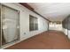 Spacious covered patio with tile flooring, offering a perfect outdoor living space at 8830 Ladrido Ln, Orlando, FL 32836