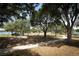 Lakeside playground featuring swings and mature shade trees, perfect for Gathering fun outdoors at 8830 Ladrido Ln, Orlando, FL 32836