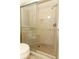 Beautiful shower with tile surround and glass door at 8830 Ladrido Ln, Orlando, FL 32836