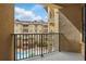 Relax on this balcony with a view of the courtyard and swimming pool below at 911 N Orange Ave # 409, Orlando, FL 32801
