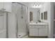 Modern bathroom with glass-enclosed shower, vanity, and updated lighting at 911 N Orange Ave # 409, Orlando, FL 32801