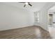 Bright bedroom featuring sleek flooring, modern ceiling fan, and a large window at 911 N Orange Ave # 409, Orlando, FL 32801