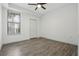 Cozy bedroom with updated flooring, ceiling fan, double closet, and natural light at 911 N Orange Ave # 409, Orlando, FL 32801