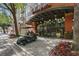 Charming entrance to Uptown Place, with hanging sphere lights, a covered walkway, and nearby parking at 911 N Orange Ave # 409, Orlando, FL 32801