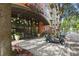 Welcoming entrance to Uptown Place, featuring glass doors, landscaping, and convenient golf cart parking at 911 N Orange Ave # 409, Orlando, FL 32801