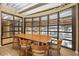 Well-lit conference room with a large wooden table and comfortable seating for meetings at 911 N Orange Ave # 409, Orlando, FL 32801