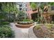 Beautiful landscaped courtyard with a lovely water feature and vibrant foliage at 911 N Orange Ave # 409, Orlando, FL 32801