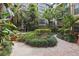 Lush courtyard featuring walking paths and a variety of plants and greenery at 911 N Orange Ave # 409, Orlando, FL 32801