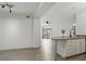Open concept living area with vinyl floors and a kitchen bar, providing seamless entertaining at 911 N Orange Ave # 409, Orlando, FL 32801