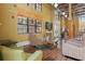 Bright lounge area with comfortable seating, media, and kitchenette for relaxation and entertainment at 911 N Orange Ave # 409, Orlando, FL 32801