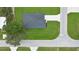 Aerial view of home showcasing its roof, driveway, and landscaping at 9472 Se 152Nd Pl, Summerfield, FL 34491