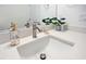 Bathroom vanity featuring quartz countertop, modern sink, and updated fixtures at 9472 Se 152Nd Pl, Summerfield, FL 34491