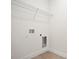 Empty laundry room with hookups and wood-look flooring at 9472 Se 152Nd Pl, Summerfield, FL 34491