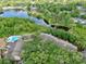 Aerial view of the community featuring a lake, pool, and lush landscaping at 956 Salt Pond Pl # 207, Altamonte Springs, FL 32714