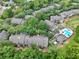 Scenic aerial view of the condo complex with a pool and lush greenery creating a peaceful setting at 956 Salt Pond Pl # 207, Altamonte Springs, FL 32714